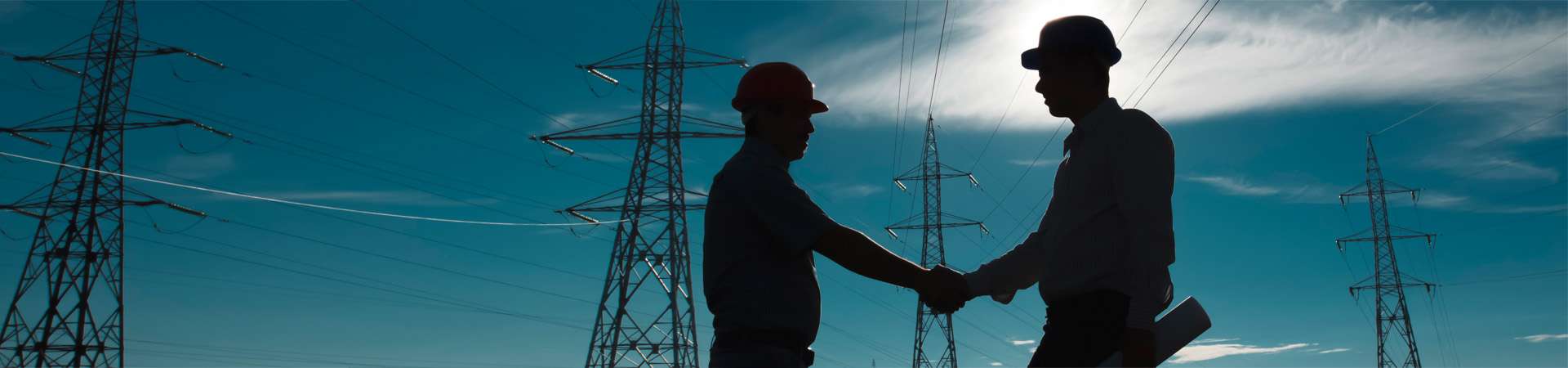 Keyvisual_PFISTERER_LAPP.jpg Handshake in front of powerlines